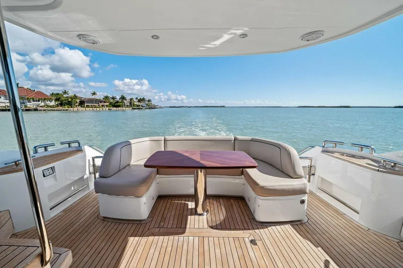 R&r Yacht Photos Pics 2023 Princess F50 yacht deck with seating, table, and ocean view.