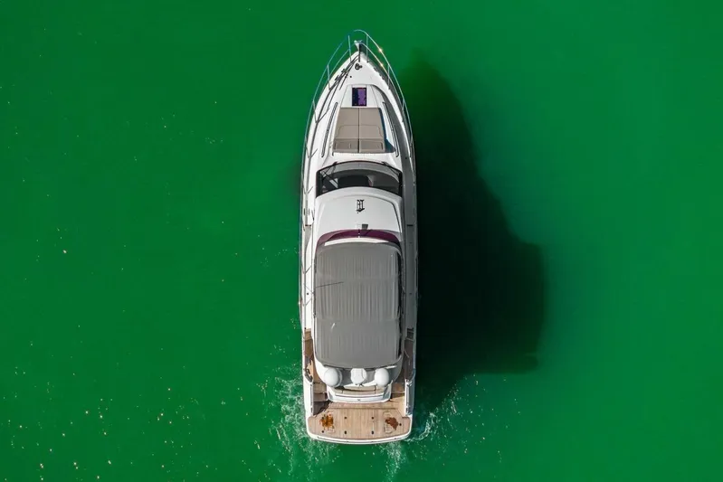 R&r Yacht Photos Pics Aerial view of 2023 Princess F50 yacht on vibrant green water.