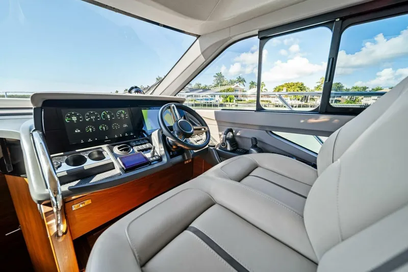 R&r Yacht Photos Pics Luxurious 2023 Princess F50 yacht cockpit with modern dashboard and plush seating.