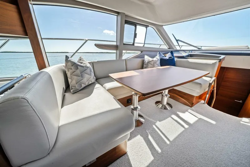 R&r Yacht Photos Pics Luxurious interior of 2023 Princess F50 yacht with elegant seating and table.