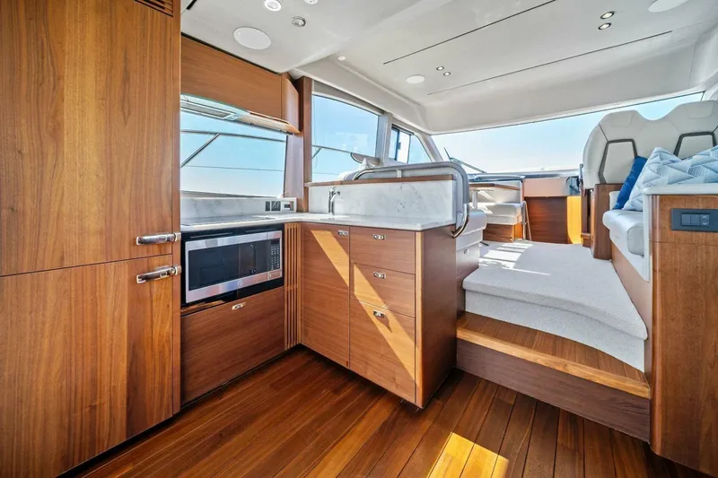 R&r Yacht Photos Pics Luxurious interior of 2023 Princess F50 yacht with modern kitchen and seating area.