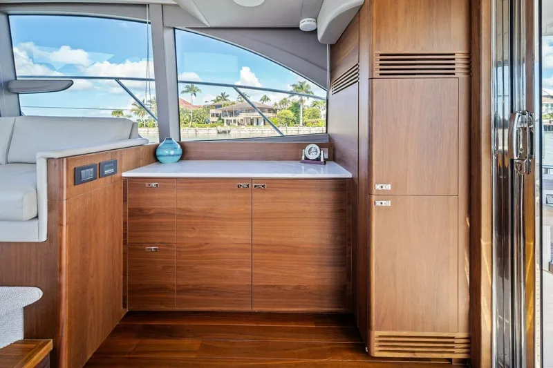 R&r Yacht Photos Pics Luxurious interior of 2023 Princess F50 yacht with wooden cabinetry and modern design.