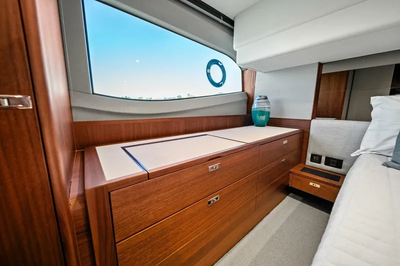 R&r Yacht Photos Pics Luxurious interior of 2023 Princess F50 yacht with elegant wood cabinetry and modern decor.