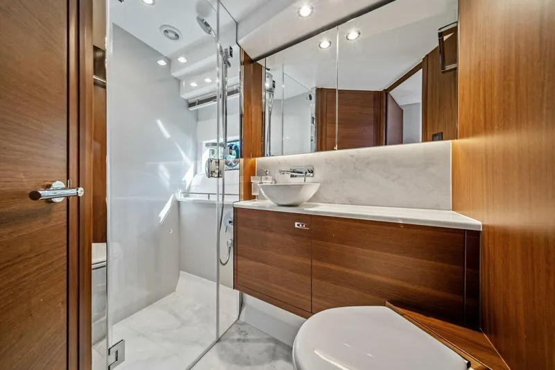 R&r Yacht Photos Pics Luxurious 2023 Princess F50 yacht bathroom with modern wood accents and elegant fixtures.
