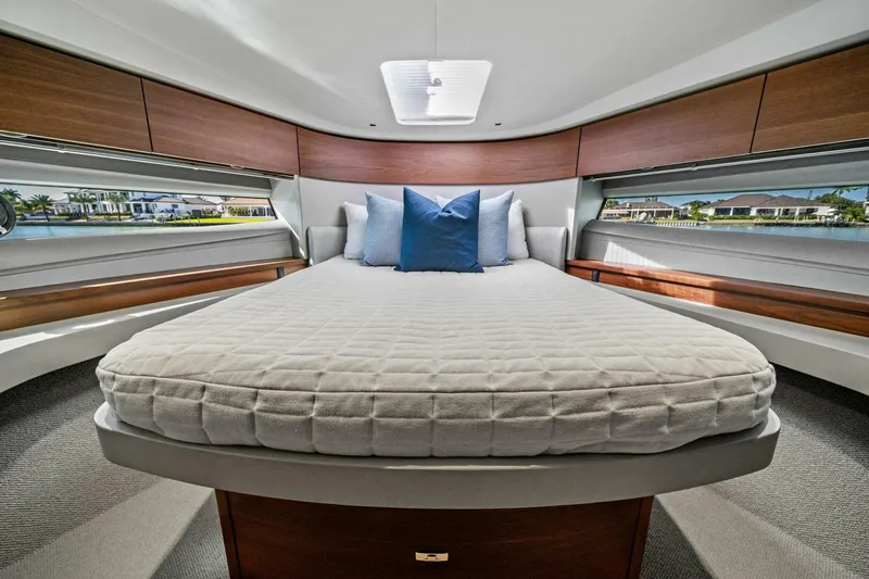 R&r Yacht Photos Pics Luxurious 2023 Princess F50 yacht bedroom with elegant bedding and scenic window views.