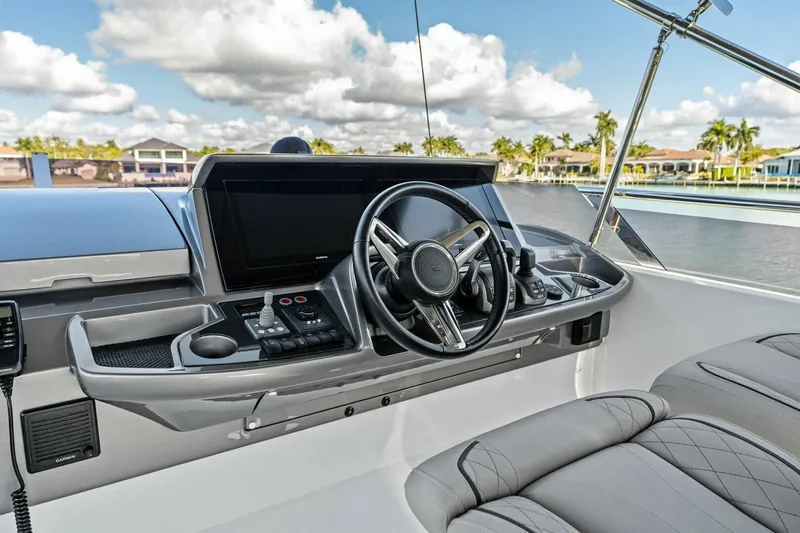 R&r Yacht Photos Pics 2023 Princess F50 yacht helm with modern controls and luxurious seating.