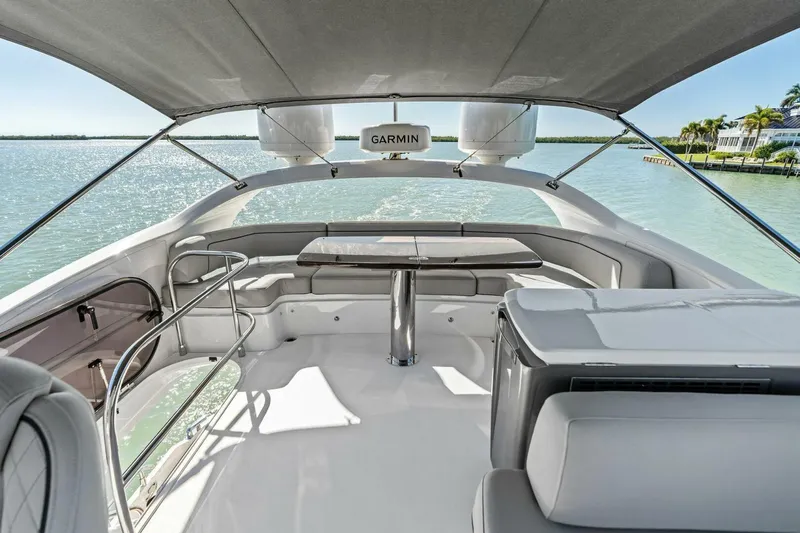 R&r Yacht Photos Pics Luxurious 2023 Princess F50 yacht interior with elegant seating and table, overlooking serene waters.