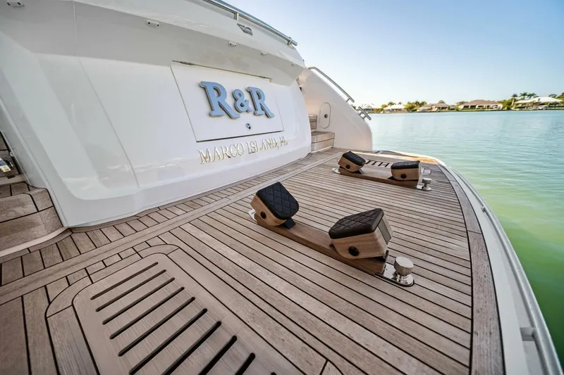 R&r Yacht Photos Pics Luxury yacht Princess F50 2023, elegant deck with "R&R" signage, Marco Island, Florida.
