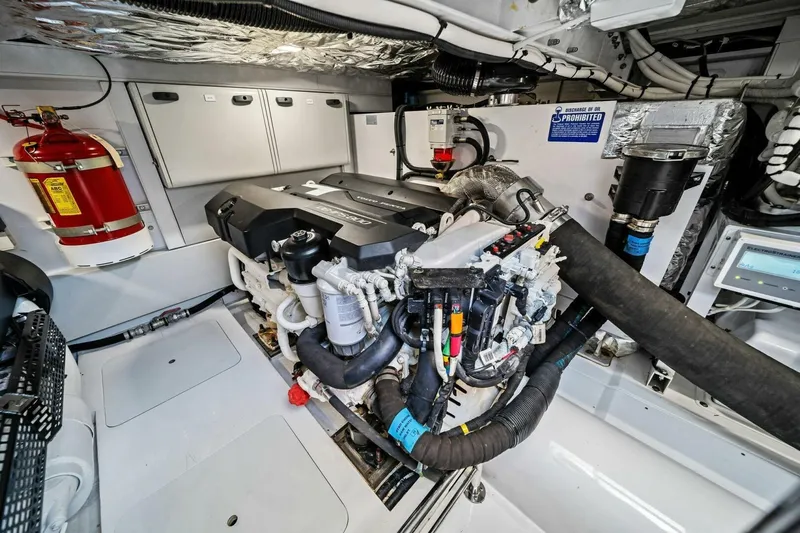 R&r Yacht Photos Pics Engine room of 2023 Princess F50 yacht with fire extinguisher and control panel.