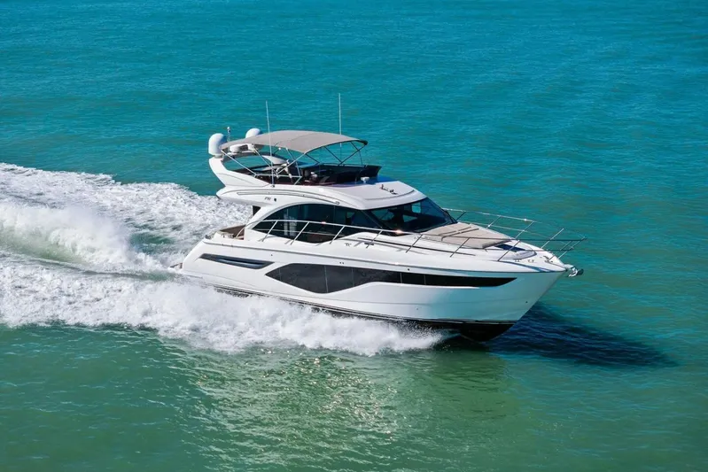R&r Yacht Photos Pics 2023 Princess F50 yacht cruising on clear blue waters.