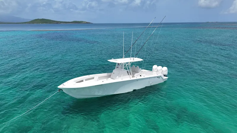  Yacht Photos Pics 2024 SeaVee 340Z boat anchored in clear turquoise waters.