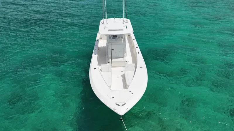  Yacht Photos Pics 2024 SeaVee 340Z boat on clear turquoise water, aerial view.