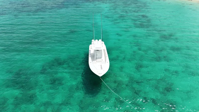  Yacht Photos Pics 2024 SeaVee 340Z boat anchored in clear turquoise water, aerial view.