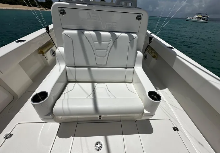  Yacht Photos Pics 2024 SeaVee 340Z boat with white seating, cup holders, and ocean backdrop.