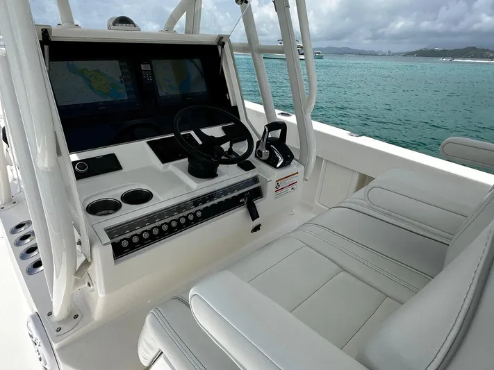  Yacht Photos Pics 2024 SeaVee 340Z boat cockpit with modern controls and dual screens on a calm sea.