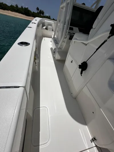 Yacht Photos Pics 2024 SeaVee 340Z boat deck, sleek design, white finish, near tropical beach.