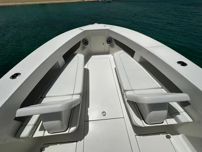  Yacht Photos Pics 2024 SeaVee 340Z boat interior with white seating, on calm water.