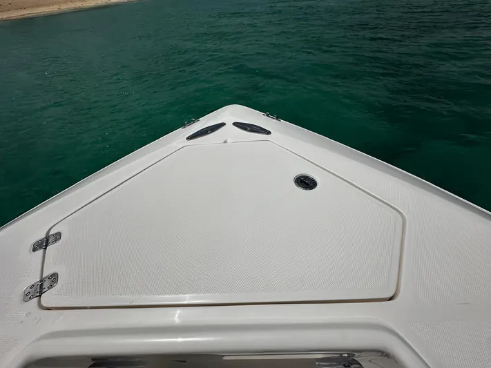  Yacht Photos Pics Bow of 2024 SeaVee 340Z boat on clear turquoise water.