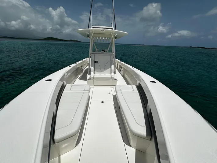  Yacht Photos Pics 2024 SeaVee 340Z boat on calm ocean waters under a cloudy sky.