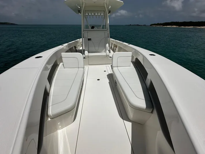  Yacht Photos Pics 2024 SeaVee 340Z boat with sleek seating, cruising on calm ocean waters.