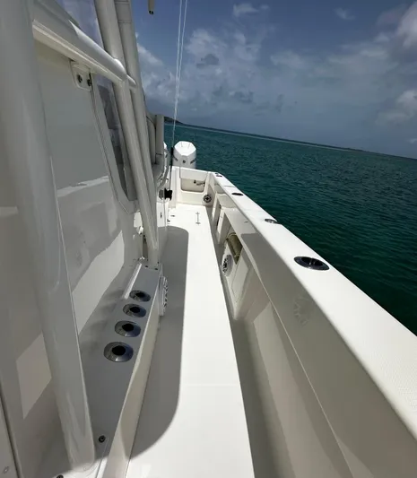  Yacht Photos Pics 2024 SeaVee 340Z boat deck with ocean view under cloudy sky.
