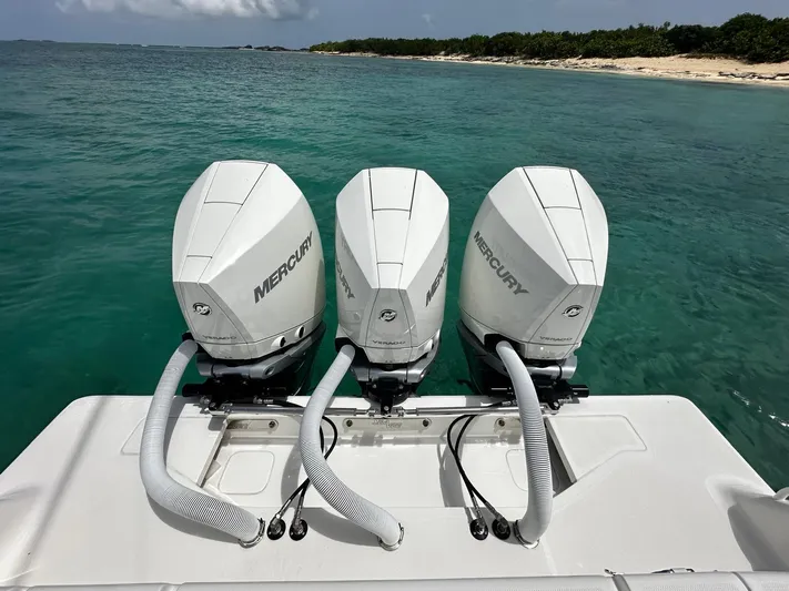  Yacht Photos Pics Triple Mercury outboard engines on a 2024 SeaVee 340Z boat in clear turquoise water.