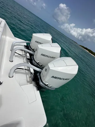  Yacht Photos Pics 2024 SeaVee 340Z boat with triple Mercury outboard engines on clear ocean water.