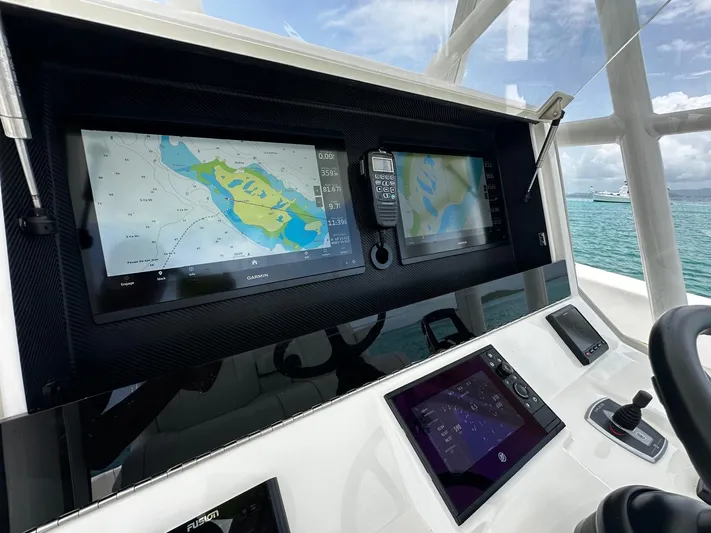  Yacht Photos Pics 2024 SeaVee 340Z boat dashboard with navigation screens and controls.