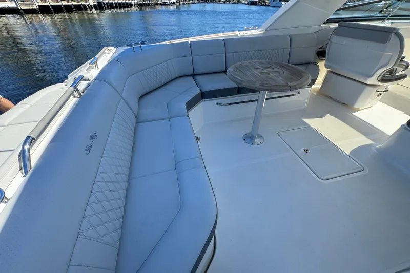 C3 Yacht Photos Pics 2022 Sea Ray SLX 400 Outboard boat interior with luxurious seating and table.
