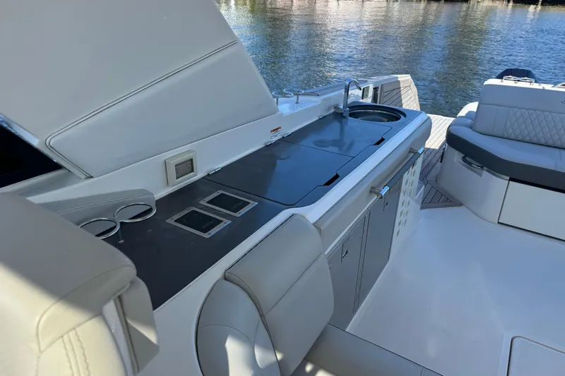 C3 Yacht Photos Pics 2022 Sea Ray SLX 400 Outboard boat interior with sleek kitchen and seating area.