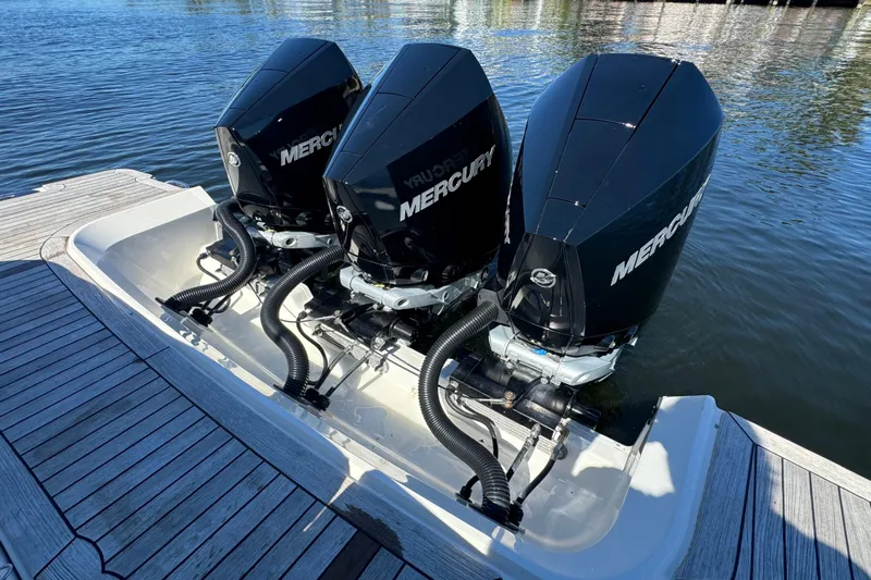 C3 Yacht Photos Pics Triple Mercury outboard engines on 2022 Sea Ray SLX 400, docked on calm water.