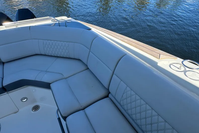 C3 Yacht Photos Pics Luxurious seating on 2022 Sea Ray SLX 400 Outboard boat, overlooking calm water.