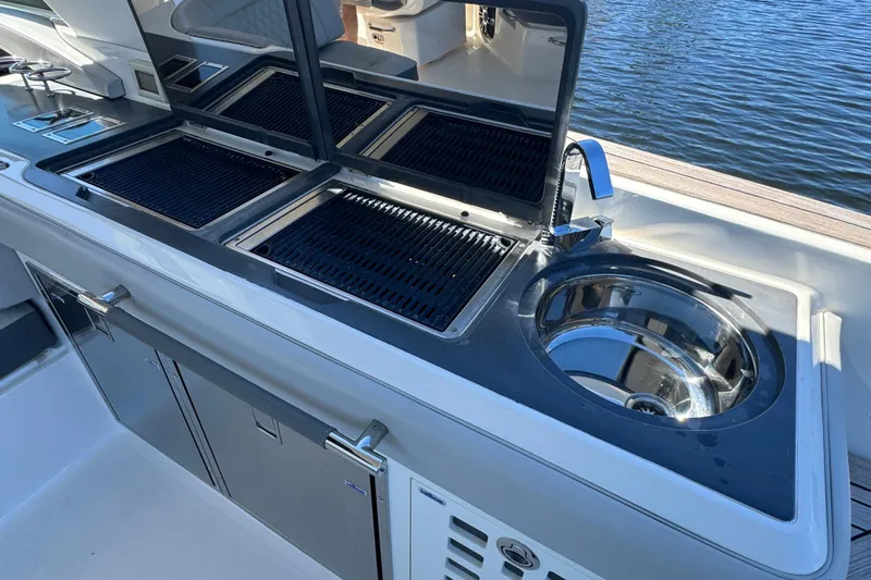 C3 Yacht Photos Pics Outdoor kitchen on 2022 Sea Ray SLX 400 Outboard yacht with grill and sink.