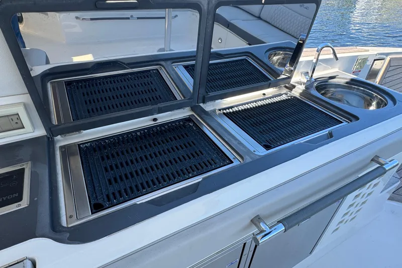 C3 Yacht Photos Pics Outdoor kitchen on 2022 Sea Ray SLX 400 Outboard yacht with grill and sink.