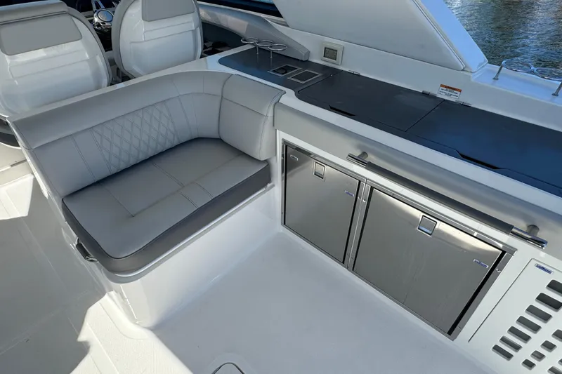 C3 Yacht Photos Pics Luxurious seating and kitchenette on 2022 Sea Ray SLX 400 Outboard boat.