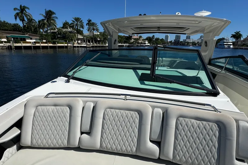 C3 Yacht Photos Pics 2022 Sea Ray SLX 400 Outboard boat with luxurious seating and waterfront view.