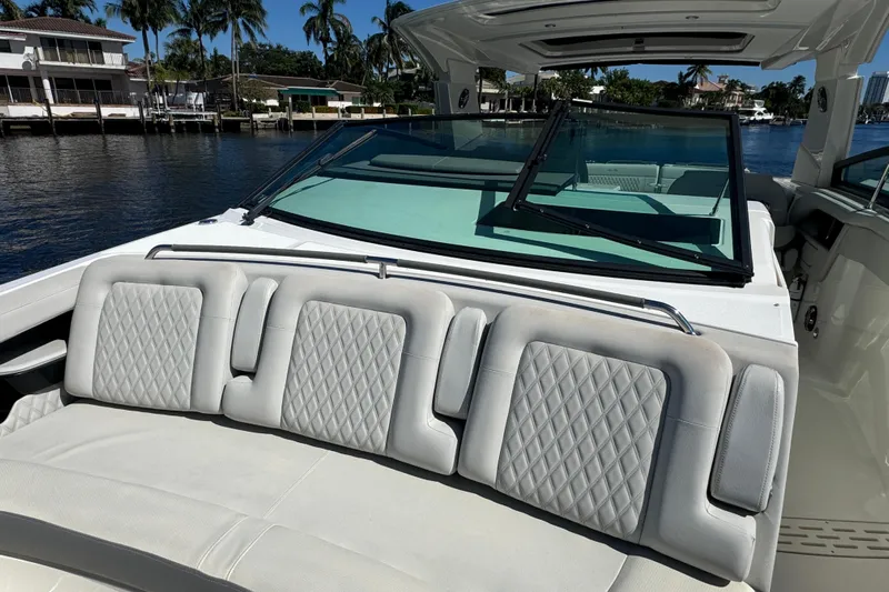 C3 Yacht Photos Pics 2022 Sea Ray SLX 400 Outboard with luxurious seating, docked by waterfront homes.