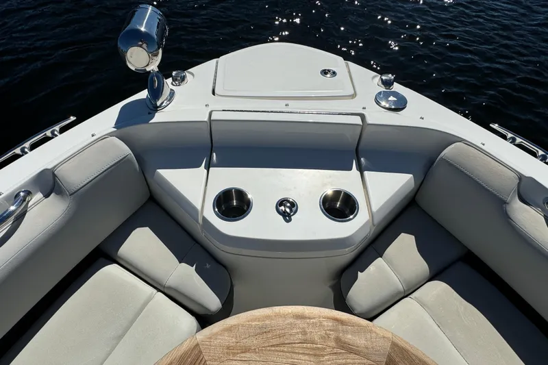 C3 Yacht Photos Pics Bow seating area of 2022 Sea Ray SLX 400 Outboard with cup holders and table.