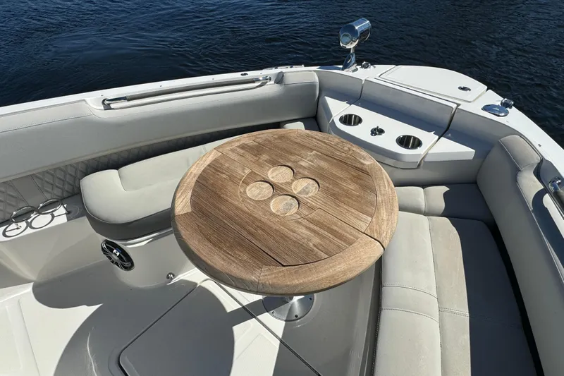 C3 Yacht Photos Pics Luxurious seating area on 2022 Sea Ray SLX 400 Outboard boat with wooden table.