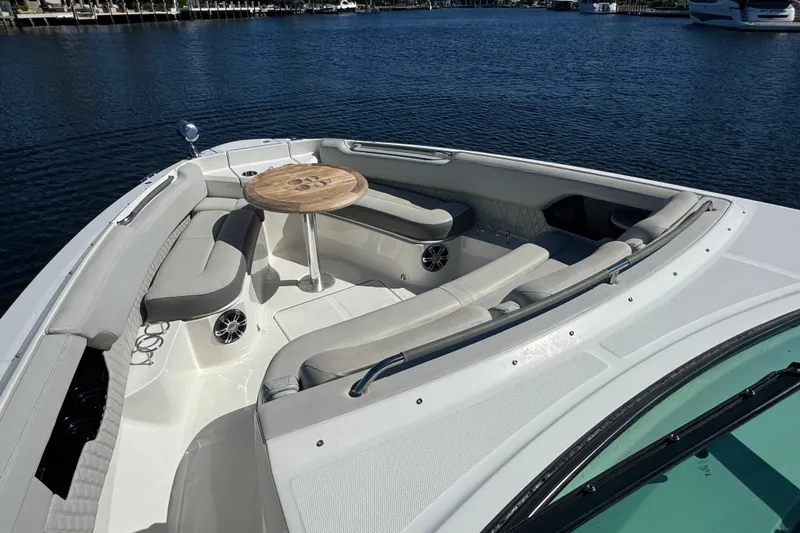 C3 Yacht Photos Pics 2022 Sea Ray SLX 400 Outboard boat with spacious seating and table on calm water.
