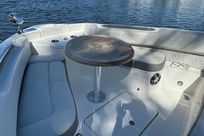 C3 Yacht Photos Pics 2022 Sea Ray SLX 400 Outboard interior with seating and table on calm water.