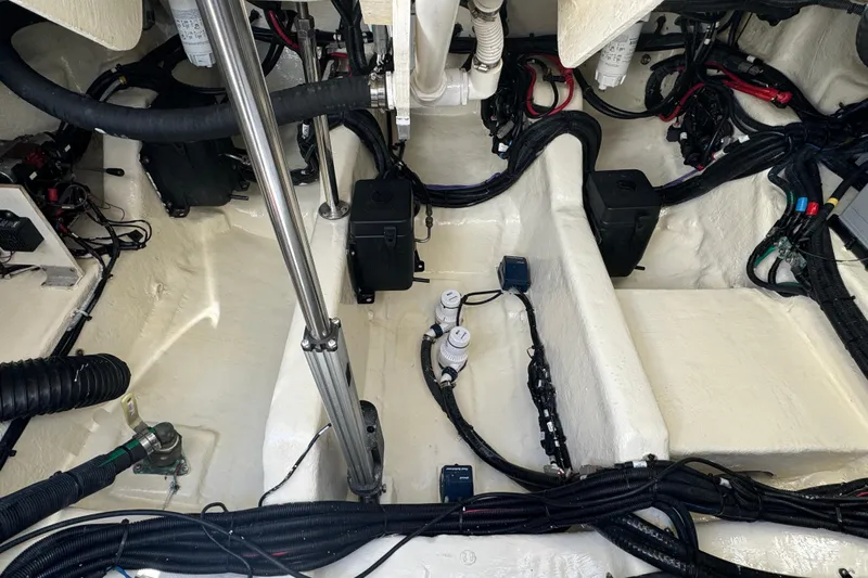 C3 Yacht Photos Pics Engine compartment of a 2022 Sea Ray SLX 400 Outboard, showcasing wiring and components.