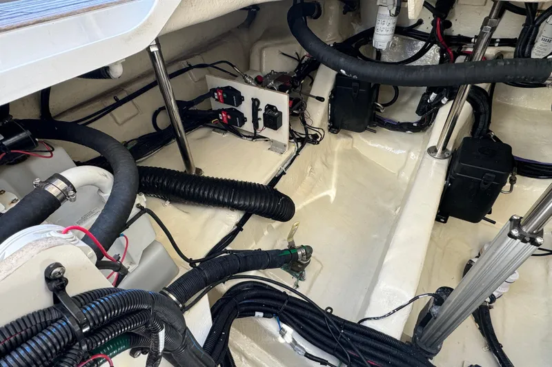 C3 Yacht Photos Pics Engine compartment of 2022 Sea Ray SLX 400 Outboard, showcasing wiring and components.