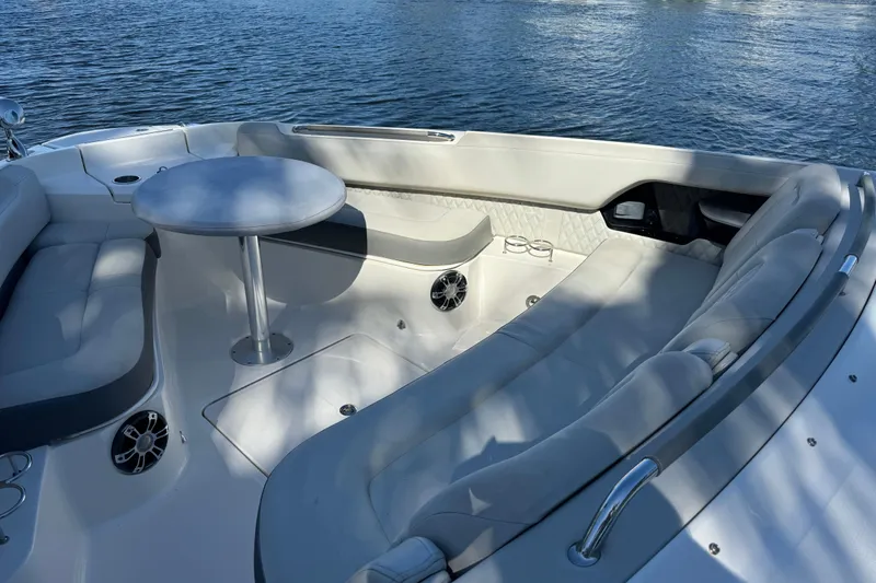 C3 Yacht Photos Pics Luxurious seating area on 2022 Sea Ray SLX 400 Outboard boat, featuring a round table.