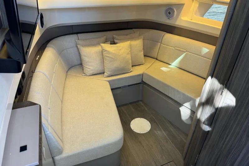 C3 Yacht Photos Pics Luxurious interior of 2022 Sea Ray SLX 400 Outboard with cozy seating and cushions.