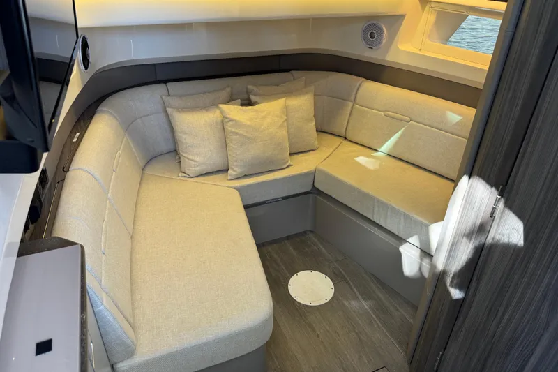 C3 Yacht Photos Pics 2022 Sea Ray SLX 400 Outboard cabin with cozy seating and modern interior design.