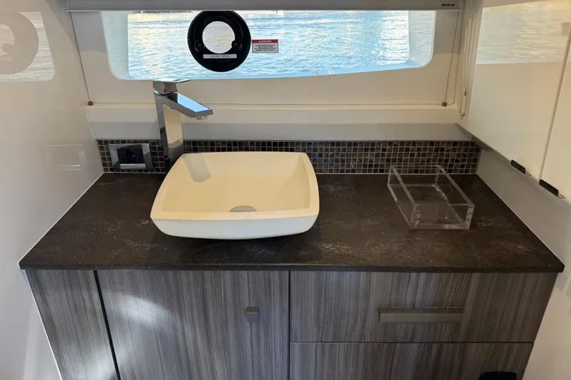 C3 Yacht Photos Pics Modern bathroom sink in 2022 Sea Ray SLX 400 Outboard yacht interior.