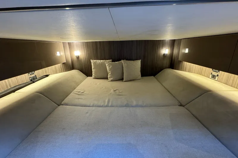 C3 Yacht Photos Pics Luxurious cabin interior of 2022 Sea Ray SLX 400 Outboard with cozy bedding.