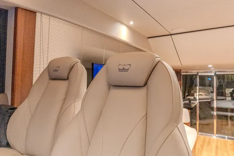  Yacht Photos Pics Luxurious interior of 2024 Princess F55 yacht with elegant beige seating.