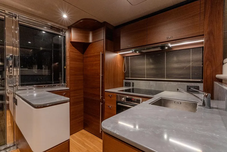  Yacht Photos Pics Luxurious kitchen interior of 2024 Princess F55 yacht with modern appliances and sleek design.